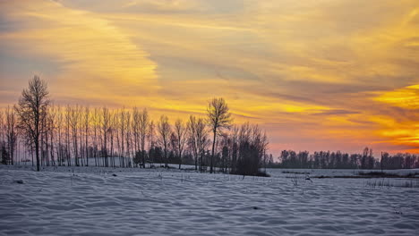 Golden-sunset-and-twilight-over-a-winter-wilderness-landscape---time-lapse
