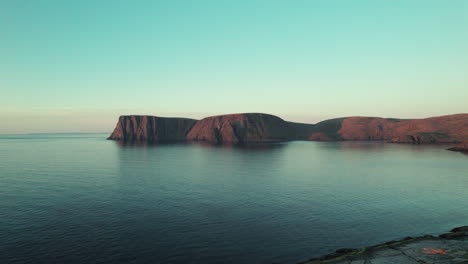 aerial view of coastline in a beautiful sunset atmosphere in northern norway, norwegian cliff landscape, north cape, scandinavia