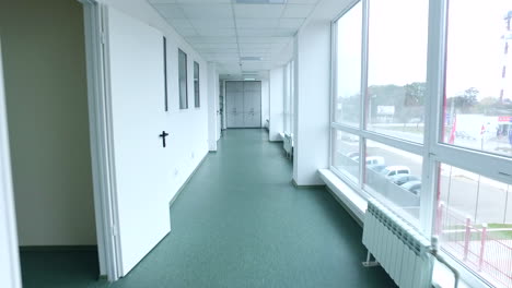 pov of walking lab corridor. steady cam shot of laboratory corridor