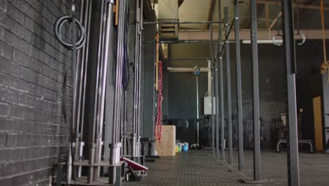 general view of multiple exercise devices at gym in slow motion