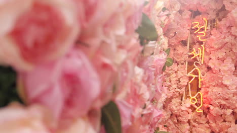 pink floral decor with neon sign