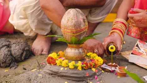 indian women putting oil in diye