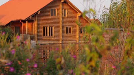 peaceful scenery with cottage by the river on a windy day