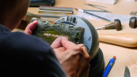 Craftswoman-working-in-workshop