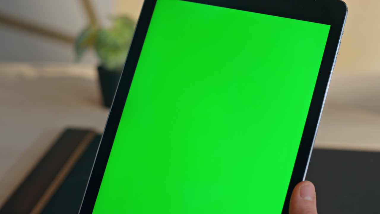 Unknown businessman surfing chroma key tablet internet on workplace closeup