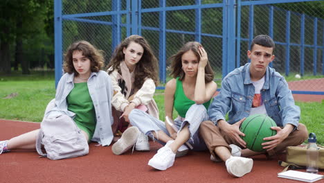 friends sitting on the sport track