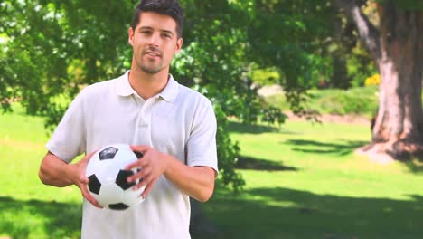 young man playing with a ball