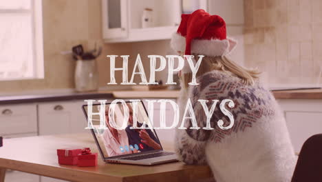 animación de navidad felices vacaciones texto sobre mujer caucásica en sombrero de santa en llamada de video portátil