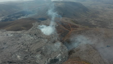 Aerial-panoramic-footage-of-massive-lave-field-created-after-volcano-eruption.-Warm-and-unstable-layer-of-magmatic-material.-Fagradalsfjall-volcano.-Iceland,-2021