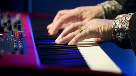 lord of old playing keyboard in musical presentation