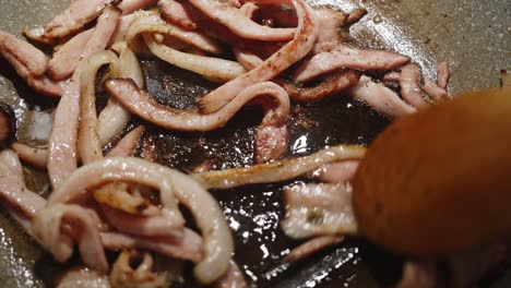 fried bacon in a frying pan in cloesup