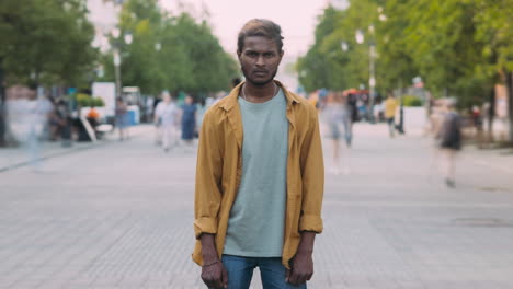 man standing on a city street