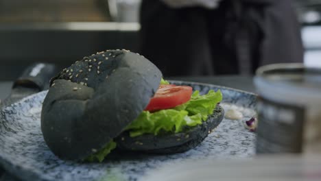 A-professional-chef-is-preparing-a-hamburger-in-his-kitchen---04