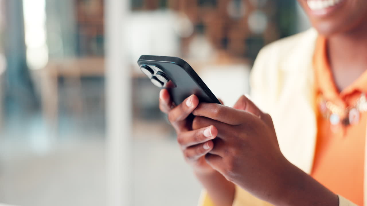 Close Up of Person's Hands Typing on a Smartphone