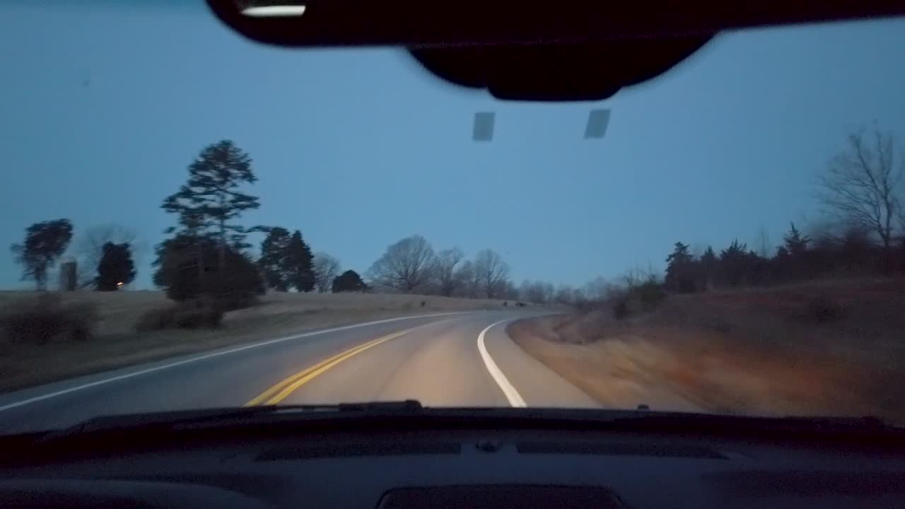 Slow motion footage of driving along several roads in central Virginia