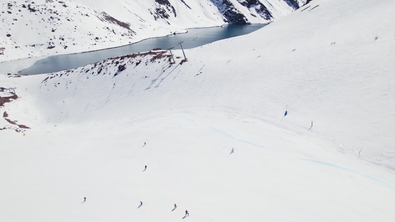 Aerial View Of Skiers At Portillo Ski Resort In The Andes Mountains Of Chile - drone shot