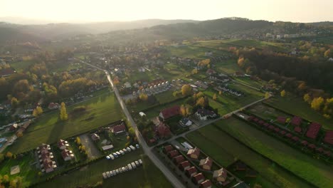 Flying-over-the-small-village-of-Polańczyk,-a-tourist-village-situated-in-Bieszczady,-near-the-border-of-Poland-with-Ukraine
