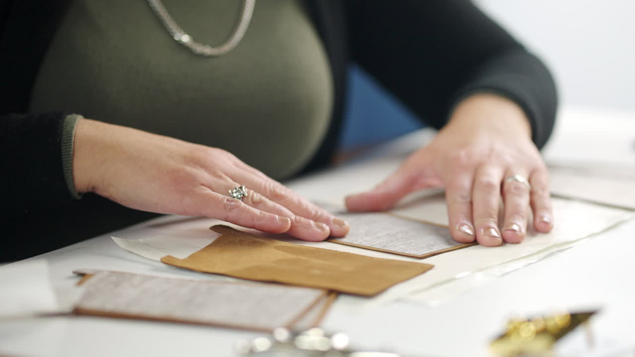 Crafting leather and paper with hands