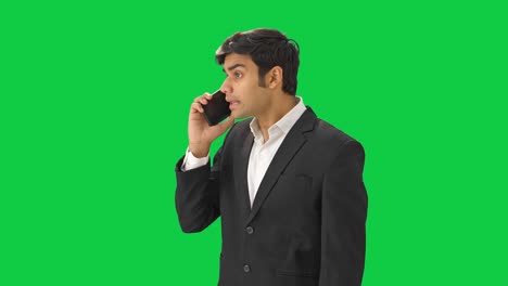 Angry-Indian-businessman-shouting-on-someone-on-phone-Green-screen