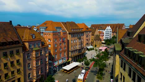 4k aerial drone video of the neighborhood behind the ancient women's gate tower in downtown nurnberg, germany