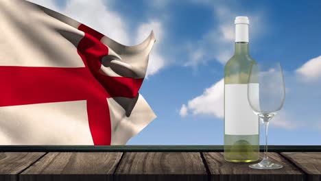 Animation-Einer-Flasche-Weißwein,-Eines-Glases-Und-Einer-Flagge-Englands,-Die-über-Einem-Hintergrund-Mit-Wolken-Weht