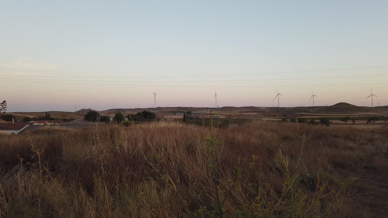 Evening sky over rural Spain with wind turbines