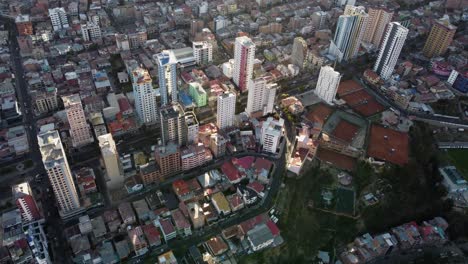 Aerial-view-of-wide-boulevard-traffic-in-capital-city-La-Paz,-Bolivia