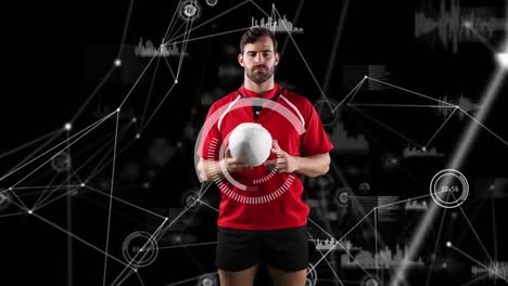 Professional-rugby-player-holding-a-ball-and-medical-data