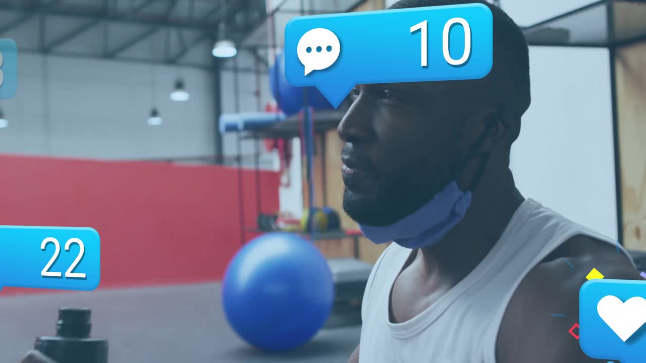 Male fitness enthusiast reaching for bottle and sipping between sets with animated likes floating