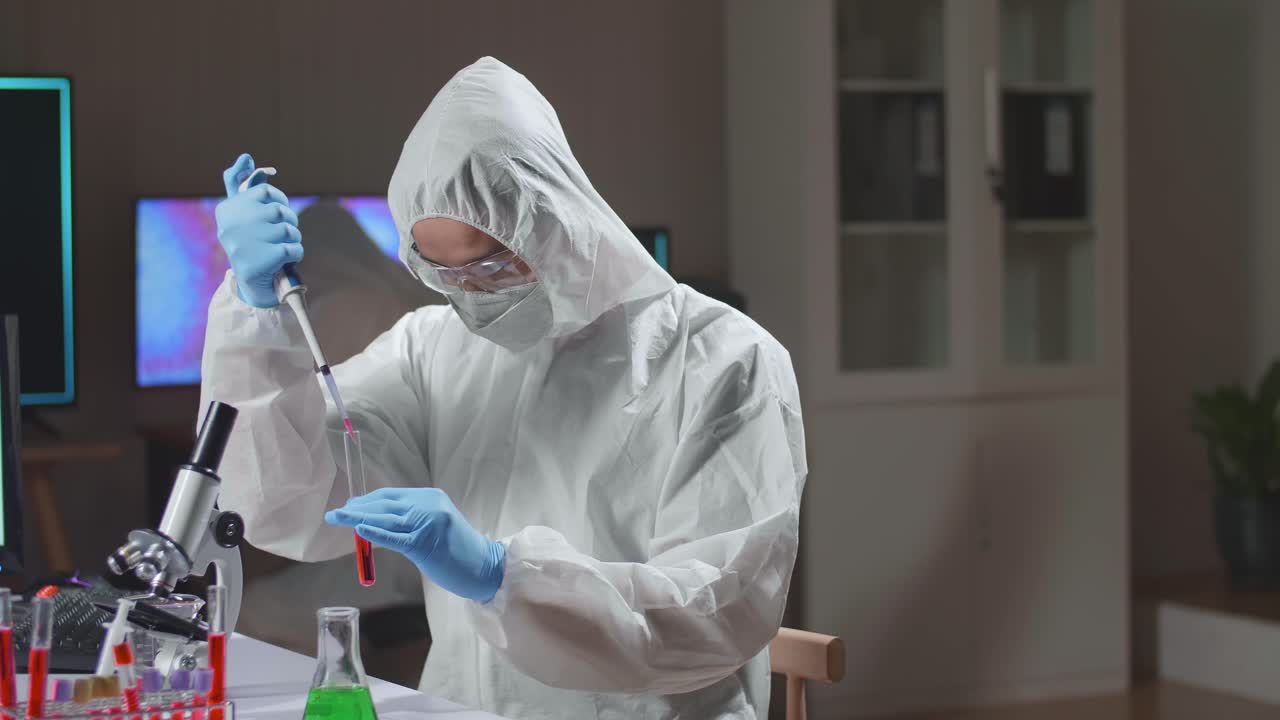 Doctor In Protective Suit Is Doing A Science Experiments And Developing Vaccine In A Modern Lab. Laboratory Assistant Workplace. The Concept Of Science And Medicine