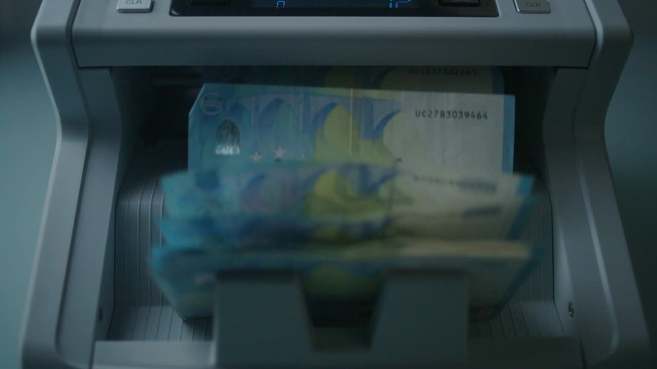 Euro Banknotes being Processed by an Automatic Counter