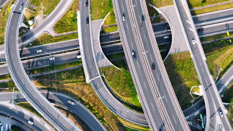 cars run quickly by the roads, loops and freeways. top view on the highway conjunction in slovakia countryside