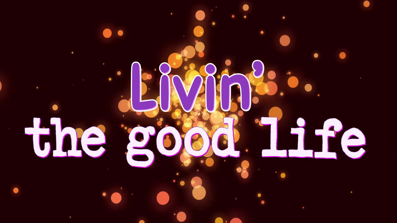 Livin' good life text animation over glowing bokeh lights on dark background