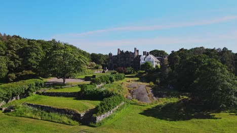 green landscape surrounding the tjoloholm castle in tjolaholms slott, kungsbacka, sweden. aerial