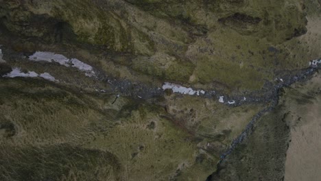 aerial top view over natural textures and patterns of the icelandic mountain terrain