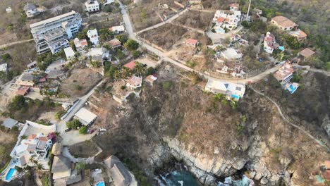 Pull-front-view-of-the-small-town-Puerto-Angel-on-the-side-of-the-cliff