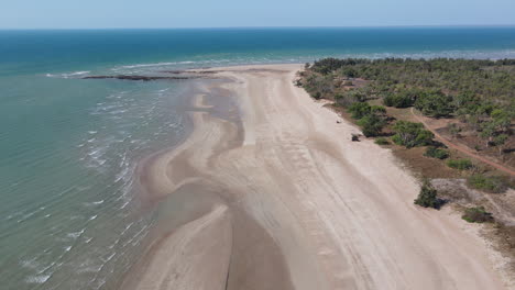 High-Aerial-drone-shot-of-White-Sandy-Beach-and-Blue-Water-Darwin,-Northern-Territory