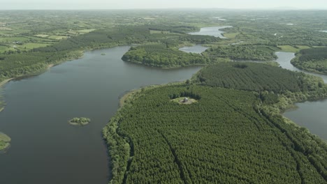 lady anne dawson temple - aerial view of dense forest on an island within the lake in county roscommon, ireland