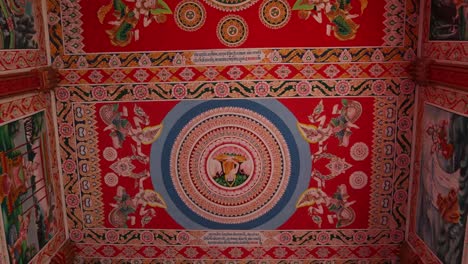 colorful religious paintings on the interior of pha that luang golden stupa buddhist temple in vientiane, laos