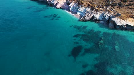 Turquoise-Majesty:-Pristine-Ionian-Sea-Waters-Embrace-the-Rocky-Coastline-in-a-Mesmerizing-Display-of-Serenity-and-Beauty-in-Lukova,-Albania