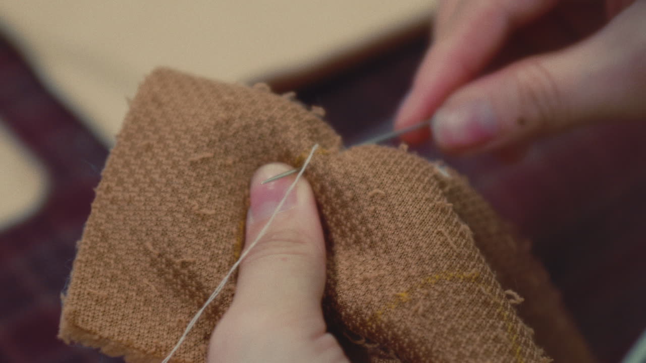 Close-up of someone hand sewing
