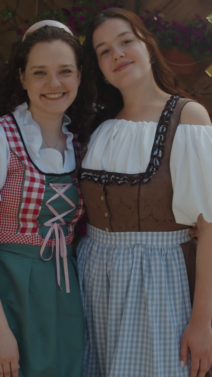 Two women in traditional Dirndl dresses