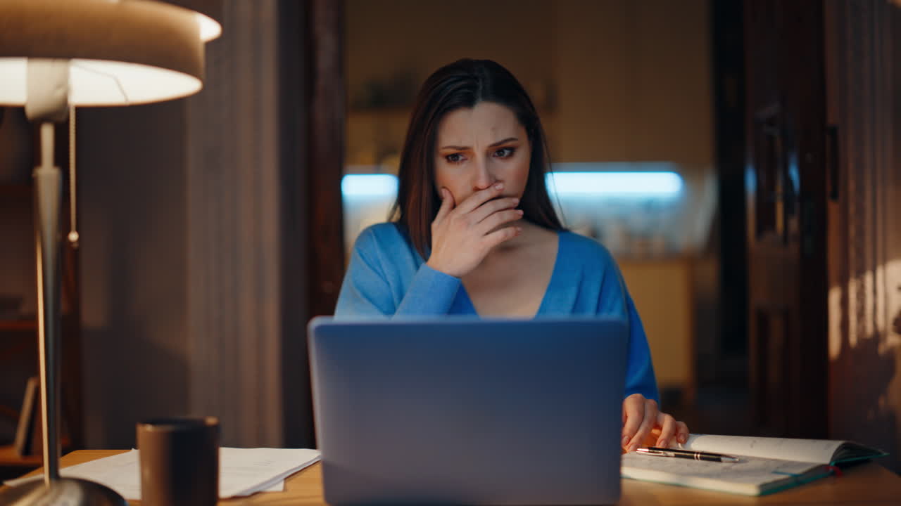 Hopelessness woman closing laptop sitting evening home feeling despair closeup