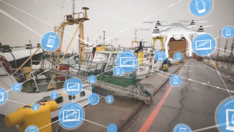 animation of network of digital icons against drone carrying a delivery box at a port