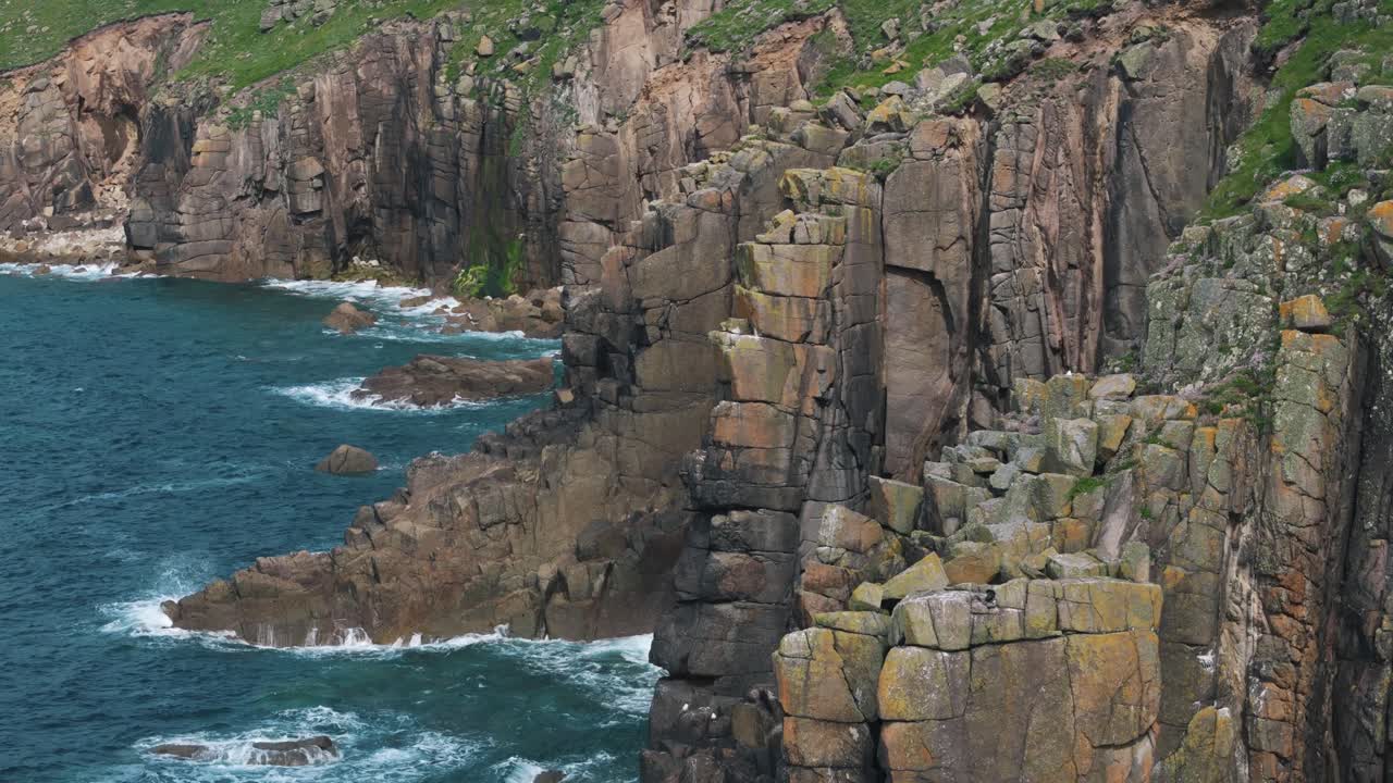Close aerial approach to sea cave in the cliffs of Land’s End