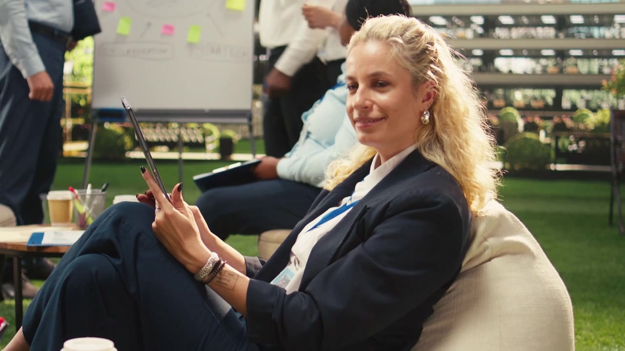 Businesswoman Using Tablet During Outdoor Office Meeting