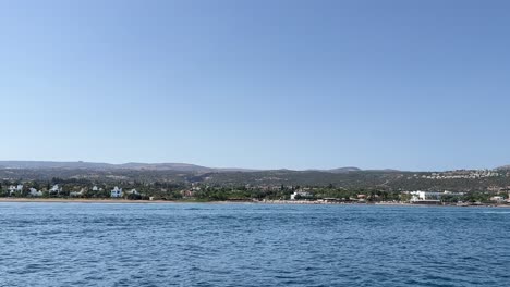 View-from-boat-sailing-in-the-large-blue-sea-near-the-coastline-of-the-long-island-in-hot-weather