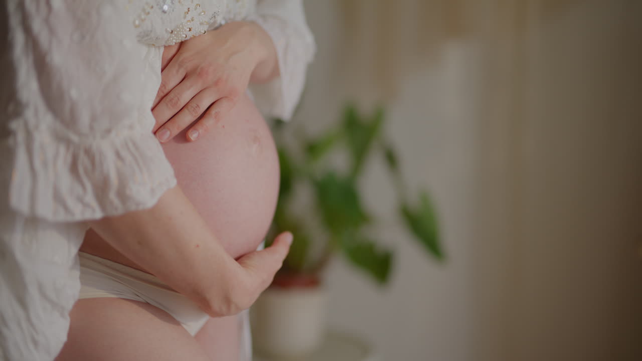 Pregnant Woman Belly Close-Up in Ninth Month