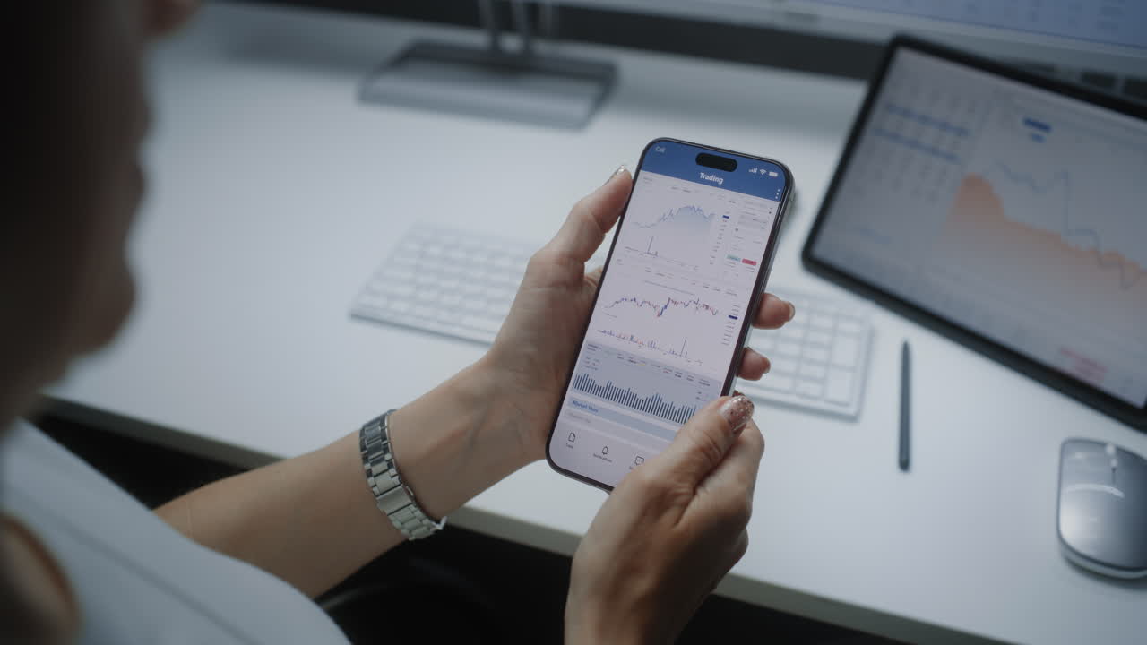 Woman Trading Stocks on Mobile Phone