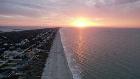 drone shot of sun rising over the ocean in emerald isle, nc